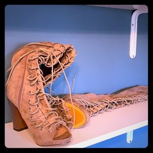 Charlotte Russe thigh-high, open toed heels.